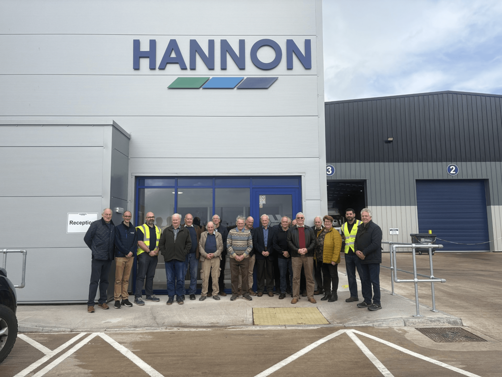 Plough On Group Visitors Outside HANNON Steel